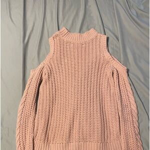 It’s a baby pink sweater